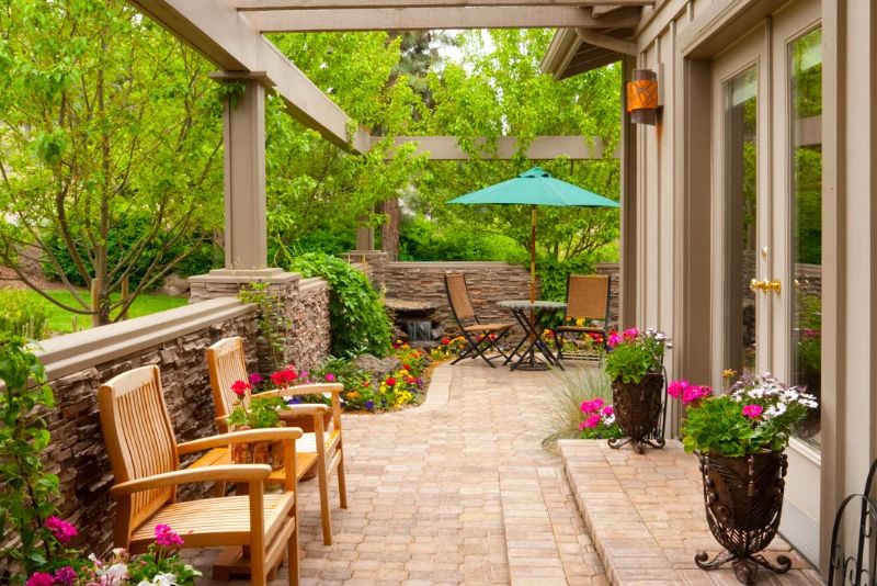 verandha with potted plants and two chairs