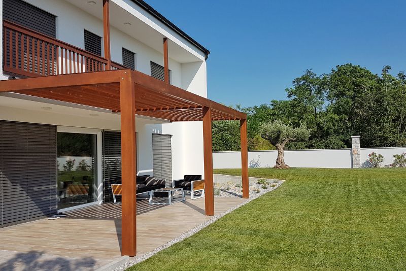 stylish timber pergola with a seating area